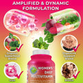 Women's Daily Multivitamin with organic superfood blend, digestive support, biotin, and iron—featuring vibrant ingredients like beets, spinach, and broccoli in a dynamic capsule illustration.