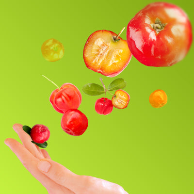 image of acerola cherries flying into a hand